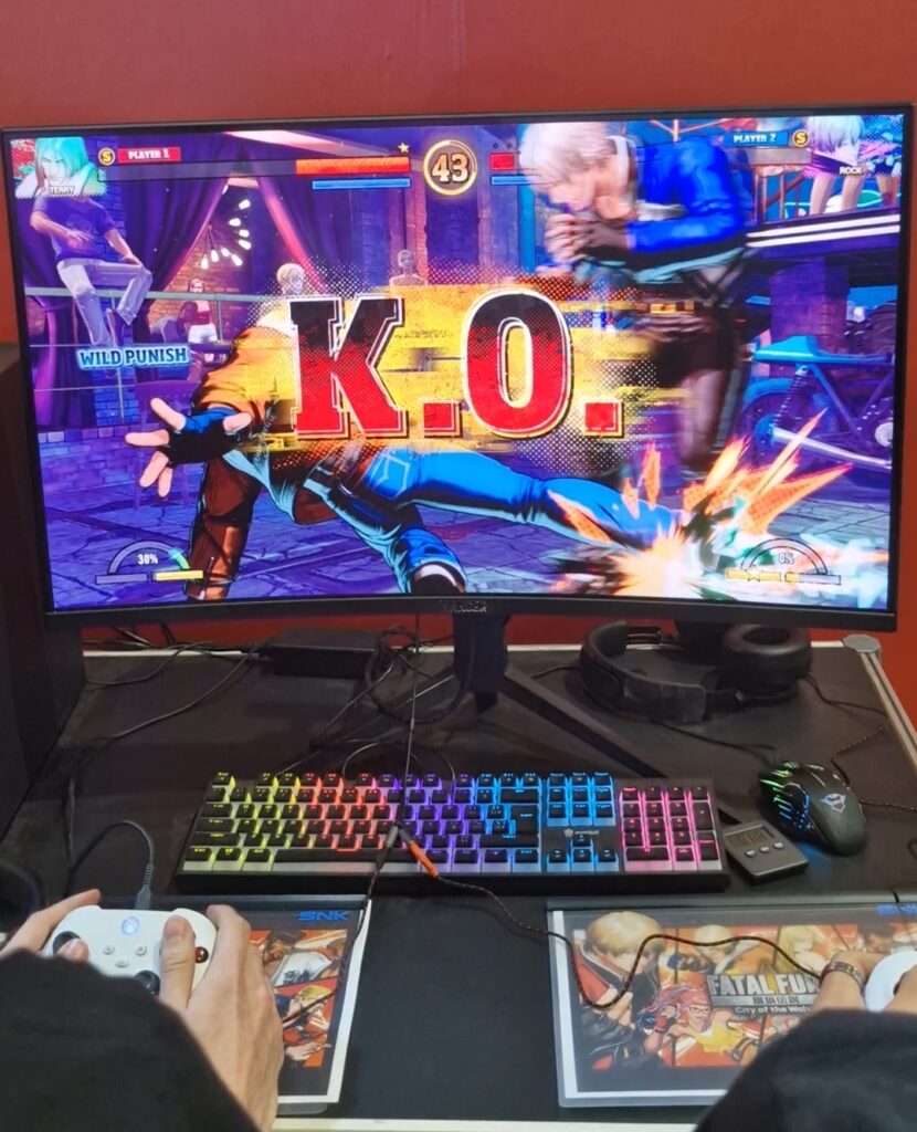 Imagem da tela que exibe "K.O." (Nocaute) no jogo Fatal Fury: City of the Wolves, que esteve disponível na BGS