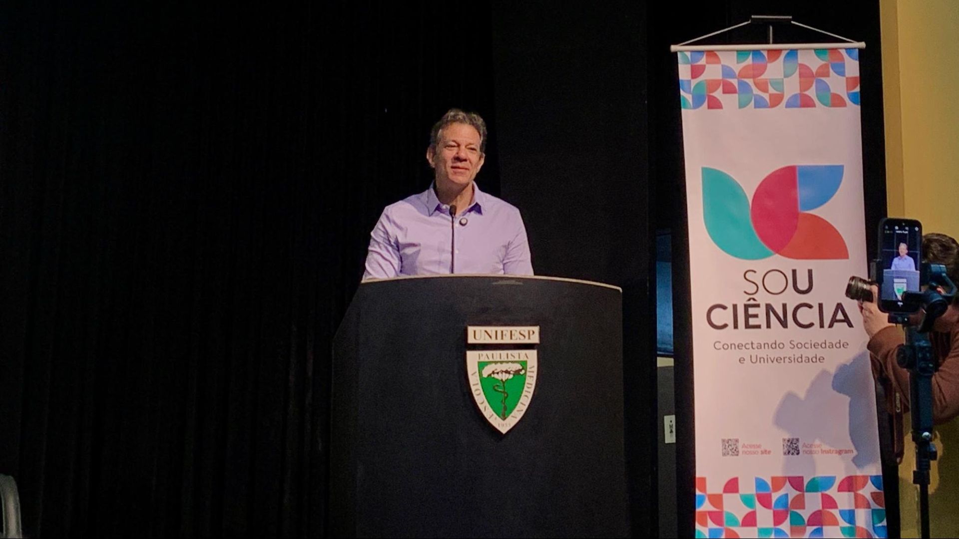 Na imagem, Fernando Haddad em um púpito em evento na Unifesp, em São Paulo
